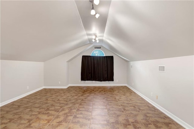 bonus room with vaulted ceiling