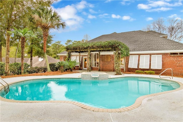 view of pool with an in ground hot tub