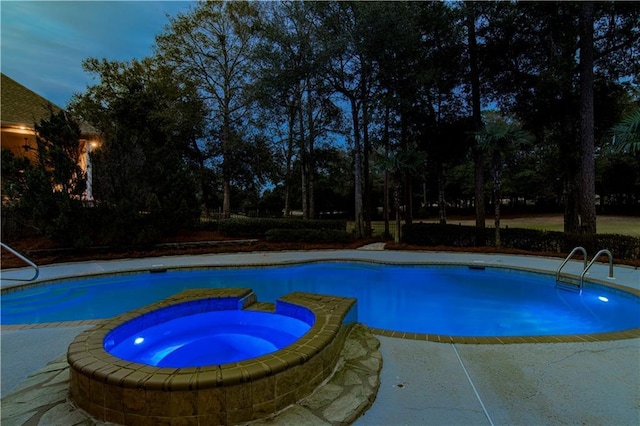 view of swimming pool with an in ground hot tub and a patio