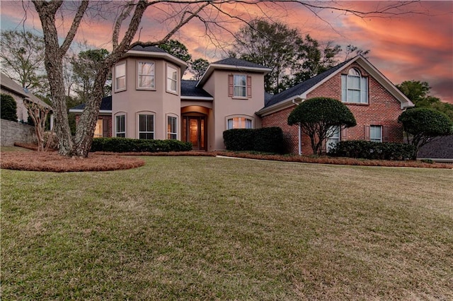 view of front of property with a lawn