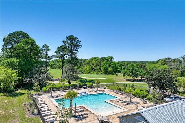 view of swimming pool with a patio area