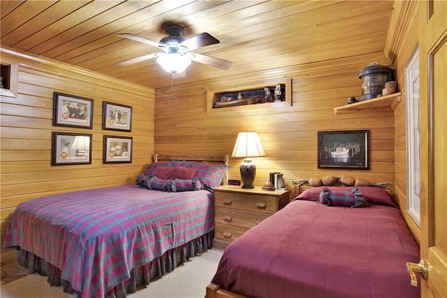 30077 River Rd, Orange Beach, AL 36561 - carpeted bedroom with wooden ceiling, a ceiling fan, and wood walls