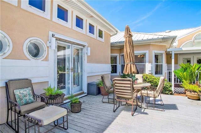 30077 River Rd, Orange Beach, AL 36561 - view of patio with french doors, a deck, and outdoor dining area