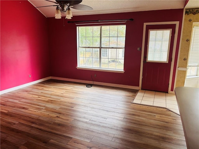 entrance foyer with ceiling fan and light hardwood / wood-style floors