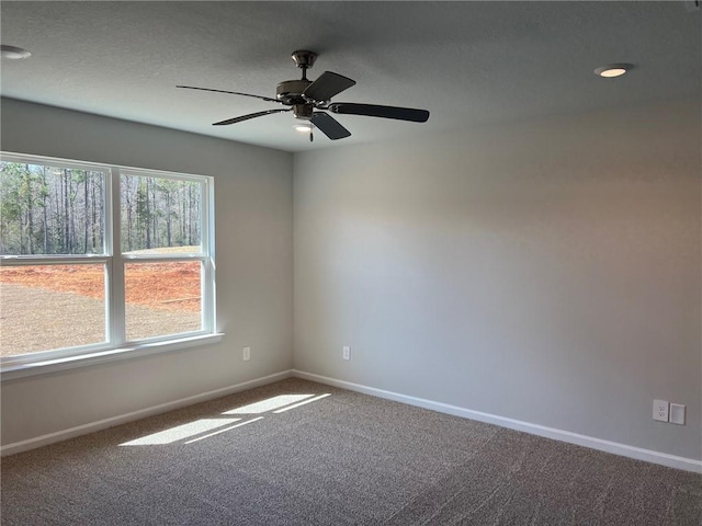 carpeted empty room with ceiling fan