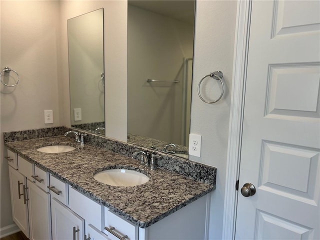 bathroom featuring double vanity