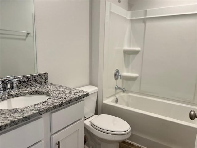 full bathroom featuring toilet, shower / bathing tub combination, and vanity