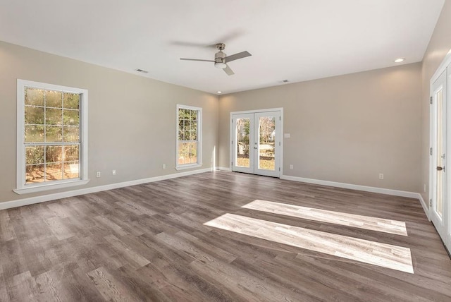 spare room with french doors, ceiling fan, and hardwood / wood-style floors