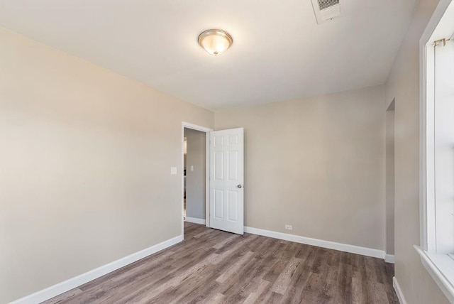 empty room featuring hardwood / wood-style flooring