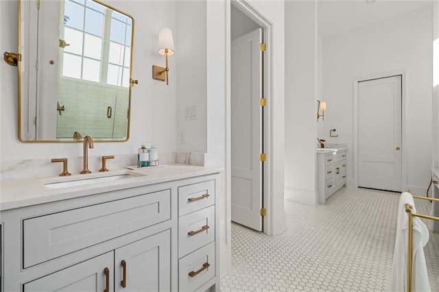 bathroom featuring vanity and an enclosed shower