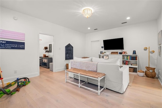 living room with light hardwood / wood-style floors