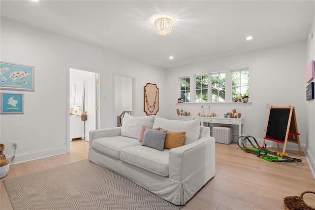 living room featuring radiator and light wood-type flooring