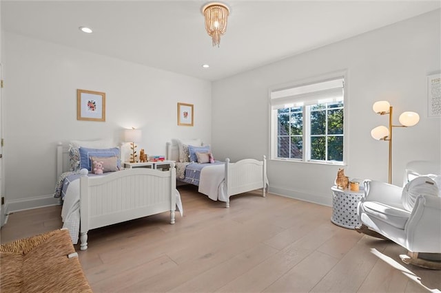 bedroom with light hardwood / wood-style flooring