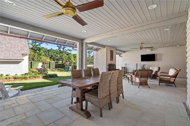 view of patio / terrace featuring a playground, an outdoor hangout area, and ceiling fan