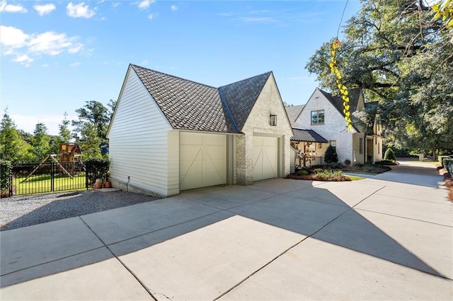 view of side of property with a garage