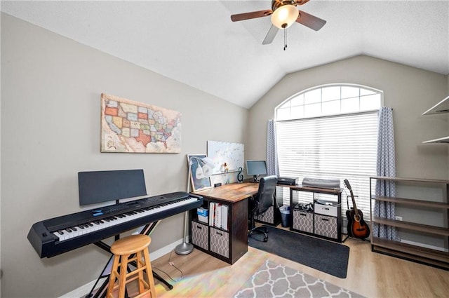 office area with lofted ceiling, light hardwood / wood-style floors, and ceiling fan