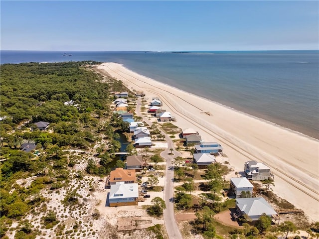 bird's eye view featuring a water view and a beach view