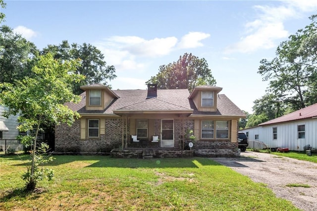 1406 Windsor Ave, Mobile, AL 36605 - view of front of house featuring brick siding, a chimney, a front lawn, and a porch