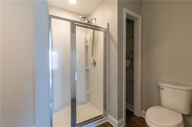 6771 Spaniel Dr Unit 3A, Spanish Fort, AL 36527 - full bath featuring a shower stall, a walk in closet, and wood finished floors