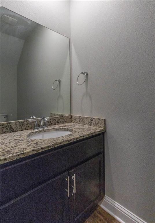 6771 Spaniel Dr Unit 3A, Spanish Fort, AL 36527 - bathroom with vanity and wood finished floors