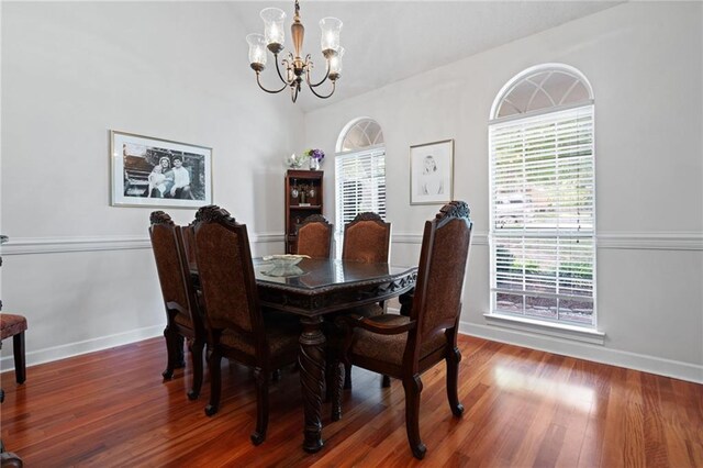 6417 Magnolia Place Ct S, Mobile, AL 36695 - dining space featuring baseboards, a notable chandelier, and wood finished floors