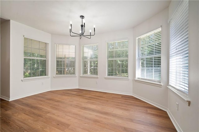 5108 Highcrest Dr, Mobile, AL 36693 - unfurnished dining area featuring a chandelier and light wood-type flooring