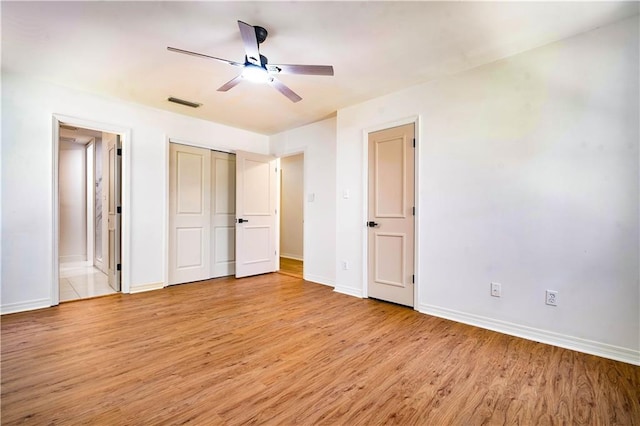 5108 Highcrest Dr, Mobile, AL 36693 - unfurnished bedroom featuring light wood finished floors, connected bathroom, and ceiling fan