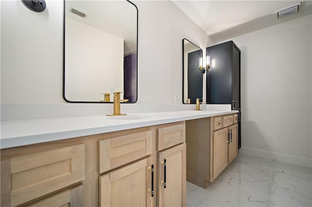 5108 Highcrest Dr, Mobile, AL 36693 - bathroom featuring double vanity and marble look tile flooring