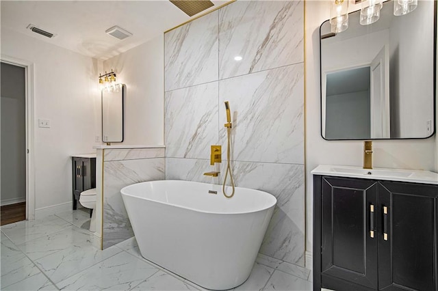 5108 Highcrest Dr, Mobile, AL 36693 - full bath with marble tiled floors, tile walls, a freestanding tub, and vanity