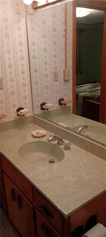 bathroom with tile patterned flooring and vanity