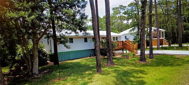 view of yard with a wooden deck