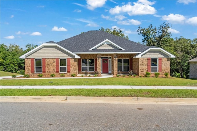 craftsman-style house with brick siding and a front lawn