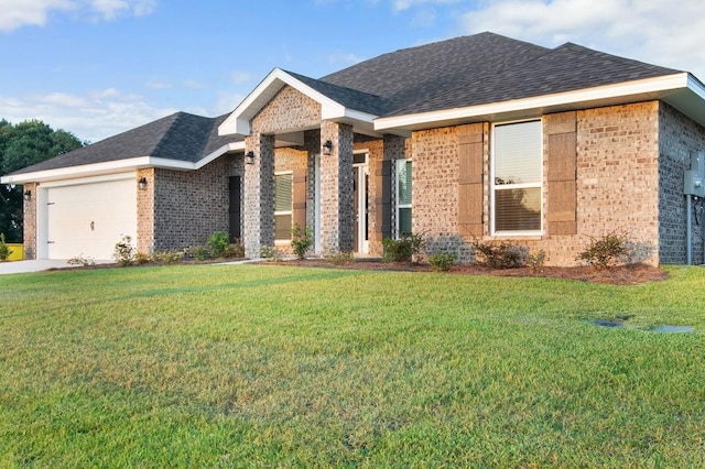 view of front of home featuring a garage and a front yard