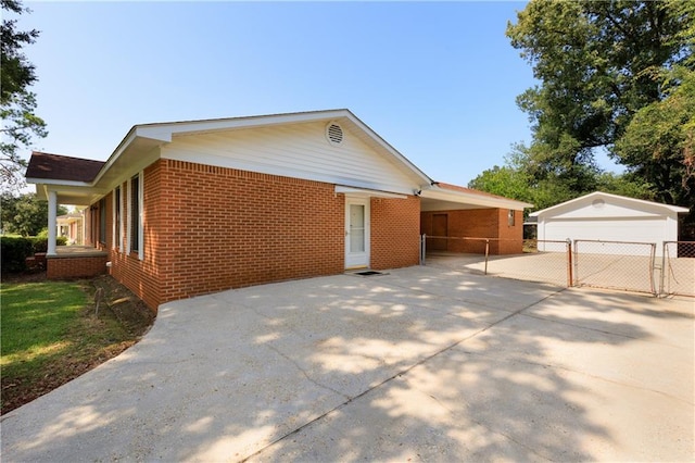 view of side of home with an outbuilding and a garage