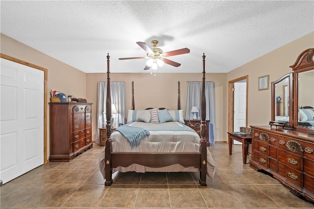 bedroom featuring a textured ceiling and ceiling fan