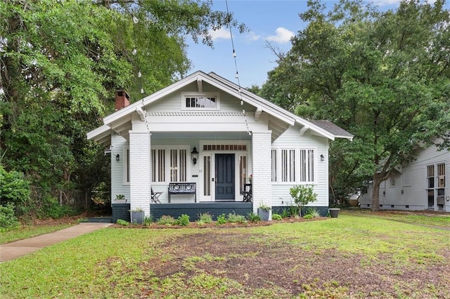 13 Demouy Ave, Mobile, AL 36606 - view of front of property featuring a chimney, a porch, and a front yard