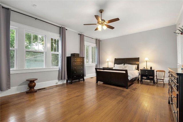 13 Demouy Ave, Mobile, AL 36606 - bedroom featuring hardwood / wood-style floors, baseboards, crown molding, and a ceiling fan