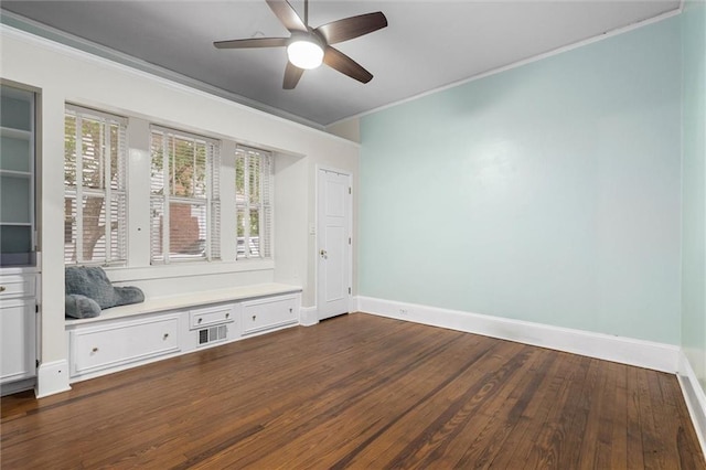 13 Demouy Ave, Mobile, AL 36606 - spare room with ornamental molding, baseboards, dark wood-type flooring, and a ceiling fan