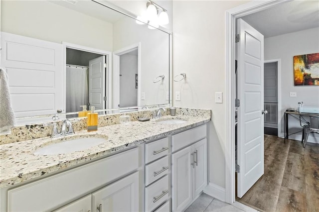 bathroom with vanity and hardwood / wood-style floors