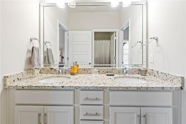 bathroom featuring vanity and walk in shower