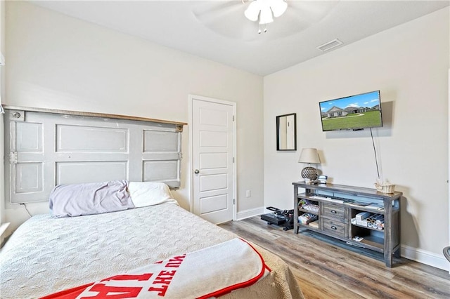 bedroom featuring hardwood / wood-style floors and ceiling fan