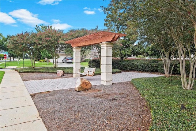 view of home's community with a lawn