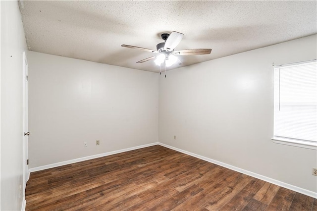 unfurnished room with wood finished floors, a textured ceiling, a ceiling fan, and baseboards