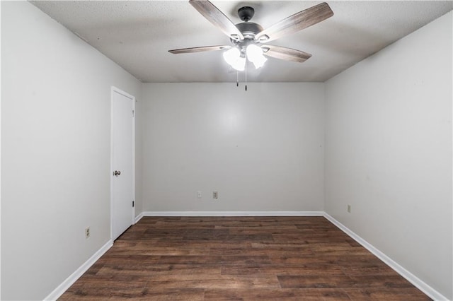 unfurnished room with ceiling fan, baseboards, wood finished floors, and a textured ceiling