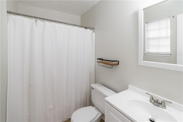 full bath featuring toilet and vanity
