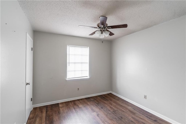 empty room featuring baseboards, a ceiling fan, wood finished floors, and a textured ceiling