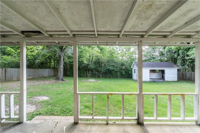 view of yard featuring a fenced backyard, an outdoor structure, and a shed