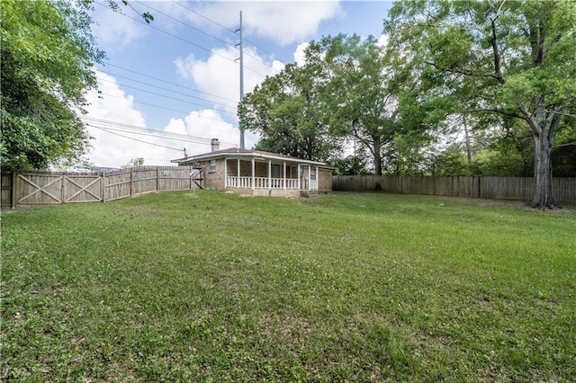 view of yard with a fenced backyard