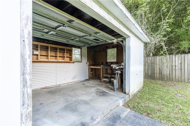 garage with fence
