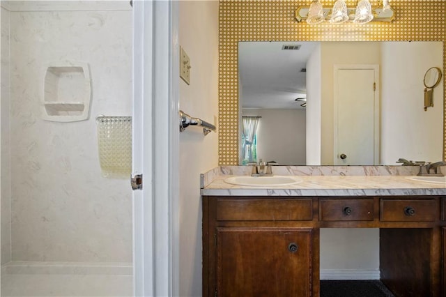 504 Vaughan Dr N, Satsuma, AL 36572 - bathroom featuring a chandelier and double vanity